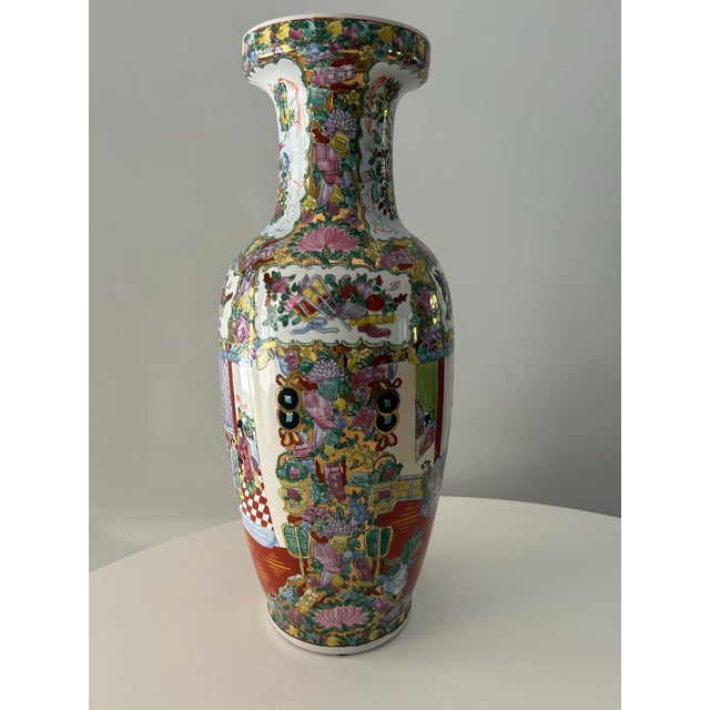This is a vintage Famille Rose vase. A Chinese, ceramic decorative baluster form, circa 1940-1950's. Elaborate depictions...
