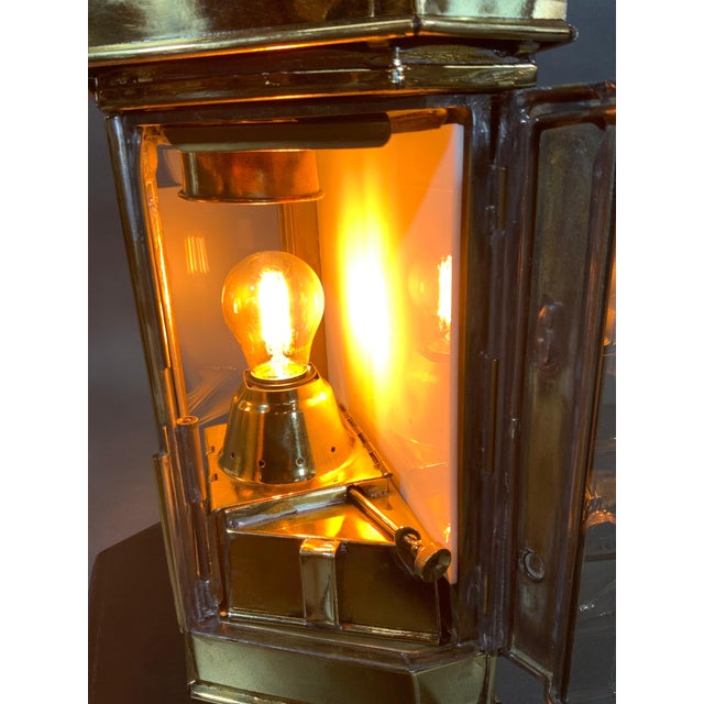 Mounted to a thick mahogany base. Fitted with a custom electric socket into the original oil burner. Choice restoration of...