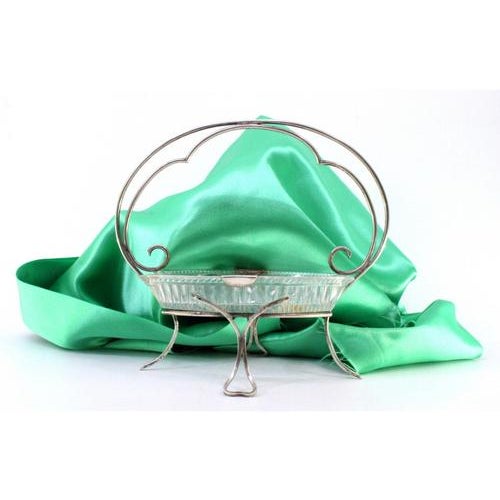 Silver and Glass Candy Box with Scrolls and Hollow Feet, in Very Good conditions. Designed 1890 to 1919 This piece has an...