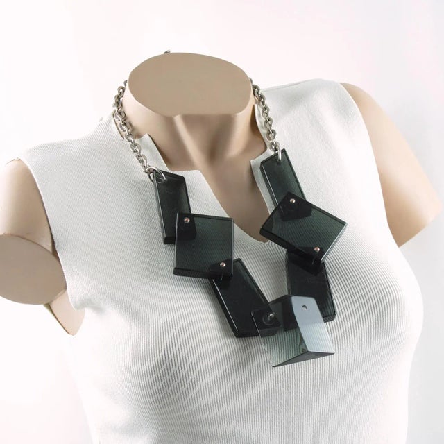 Stunning modernist bib necklace. Features a modern handmade geometric choker necklace. Each Lucite or Plexiglass extra-...