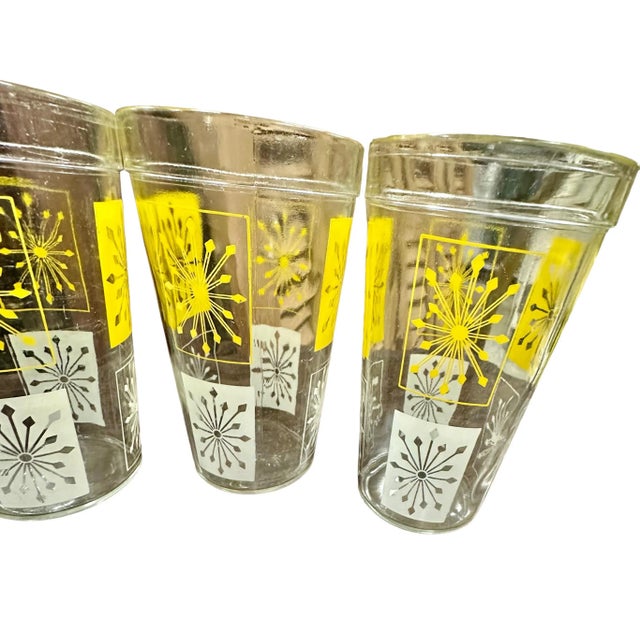 Vintage Mid-Century Modern yellow and white atomic starburst glassware set. This vintage set of 5 glasses feature a...