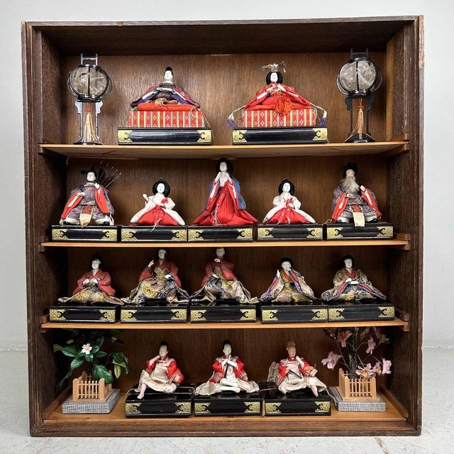 Beautiful and Authentic Hina Matsuri Doll Display in Original Wooden Case. This set up includes 15 Hina dolls and several...