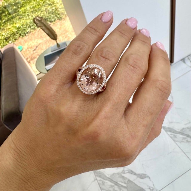 Gender: Ladies Metal Type: 14K Rose Gold Ring Size: 7 Weight: 7.12 grams One ladies 14K rose gold diamond and morganite...