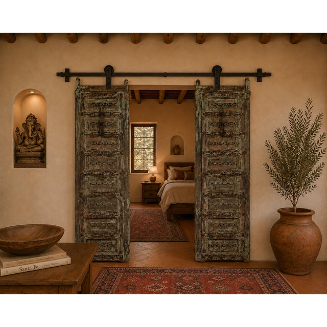 Antique Indian Carved and Painted Teakwood Gujarati Door, each door panel with 8 panels, centered with an iron strap with...