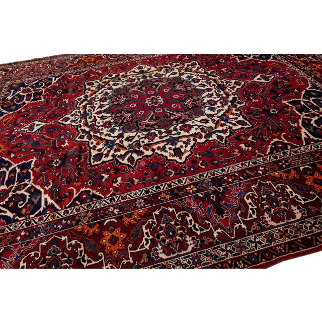 1920s Red Antique Persian Bakhtiari Handmade Wool Rug With Rosette Design For Sale - Image 5 of 7