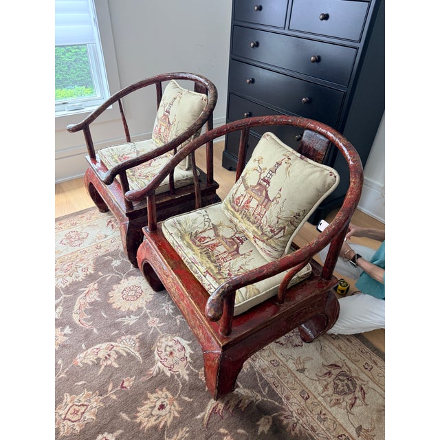 Pair of 19th Century Horseshoe Chairs A striking pair of chairs with original deep lacquer red finish. The duo is...
