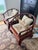 Pair of 19th Century Horseshoe Chairs A striking pair of chairs with original deep lacquer red finish. The duo is...