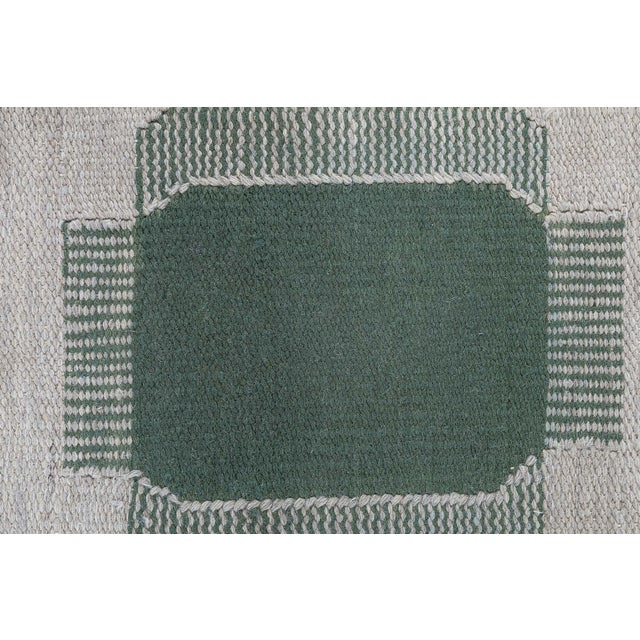 This modern Swedish flat-weave wool runner embodies the understated elegance and graphic clarity characteristic of...