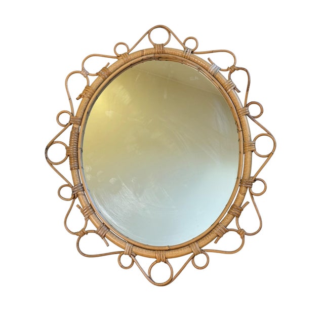 Magnificent oval rattan mirror from the 1950s. Handcrafted in the south of France.