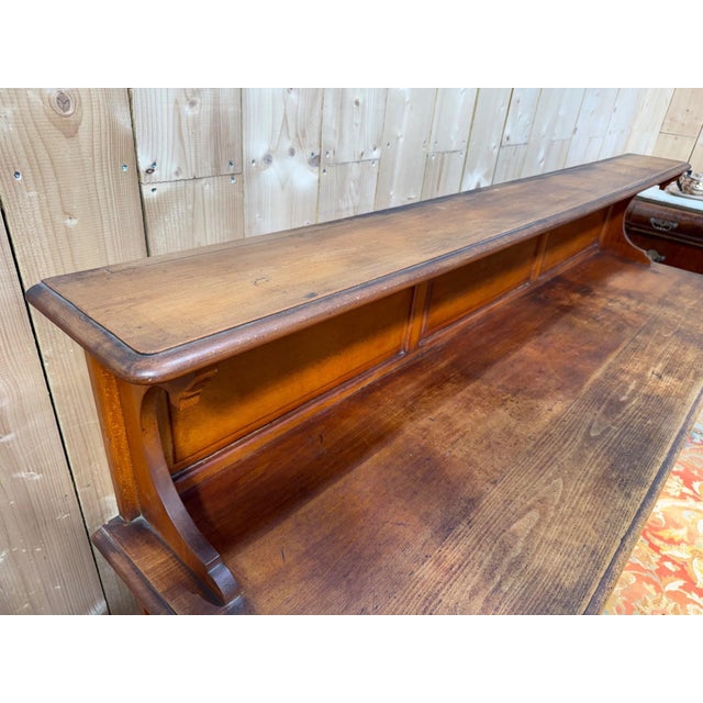 Solid beechwood brasserie buffet, stained, circa 1940/1950. The lower section comprises three doors fitted with nickel-...