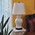 Elegant vintage Chinoiserie temple jar table lamp featuring a glossy white glazed ceramic body with classic Asian-inspired...