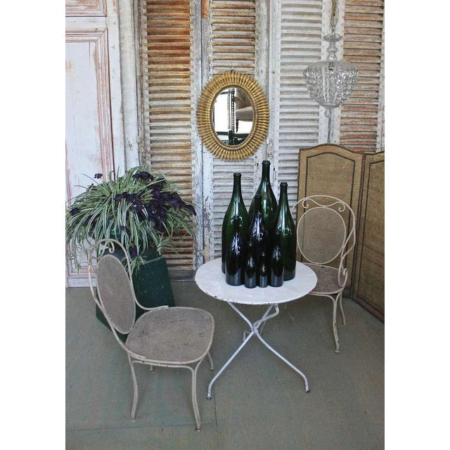 This set of eight vintage French champagne bottles from the 1920s offers a unique charm. Their sizes vary, ranging from...