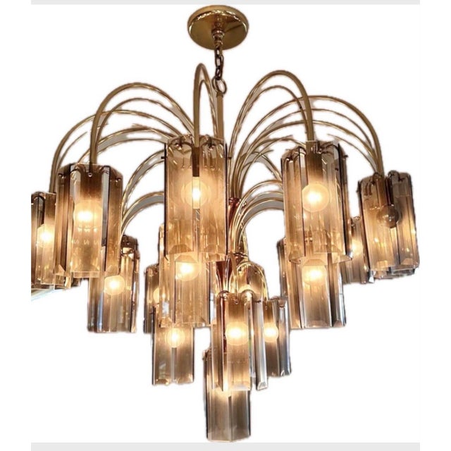 Grand-scale vintage 1970s waterfall chandelier with 22 lights and smoked-glass crystals. Made of gold metal, probably...