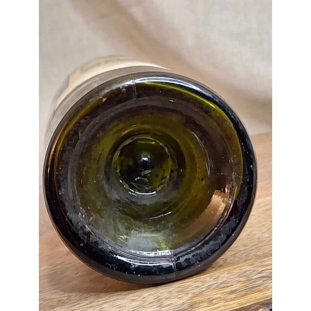 Presenting a highly collectible, empty vintage wine bottle from the legendary 1947 vintage of Château Cos d’Estournel,...