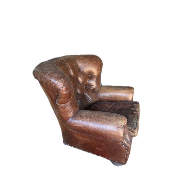 This is a genuine Restoration Hardware Churchill chair in brown leather, a classic library and den piece. RH currently...
