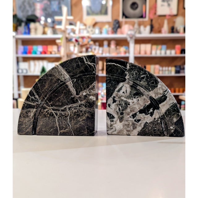 Pair of Italian Postmodern bookends, c.1980s. Solid black marble with white and gray veining, polished to a high-gloss...