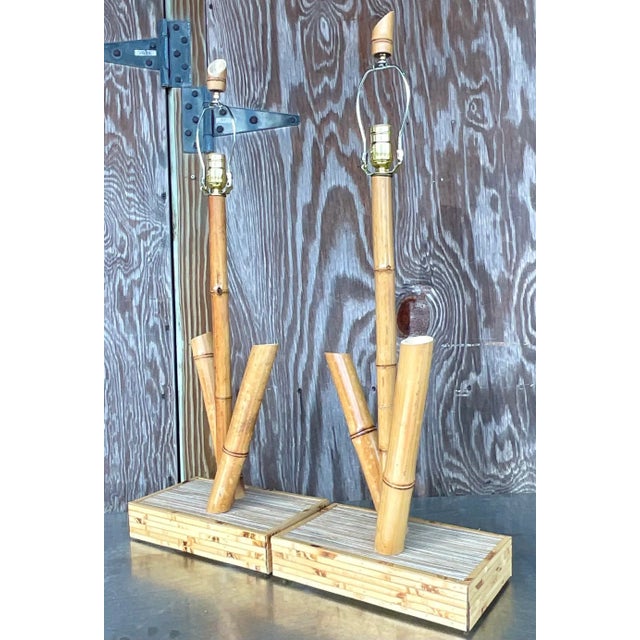 A fabulous pair of vintage Coastal table lamps. A chic bamboo design with a wrapped bamboo plinth. Acquired from a Palm...