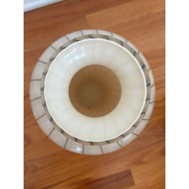 Add a striking graphic element to your interior with this exceptional vintage hand-blown art glass vase. Standing at an...