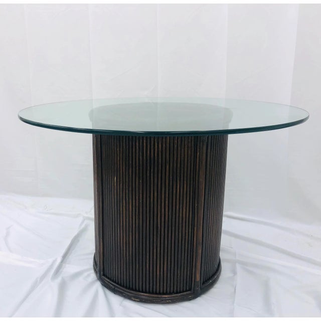 Fantastic Vintage Mid Century Era Split / Pencil Reed Rattan Table with Round Glass Top. Original finish fittings glass...