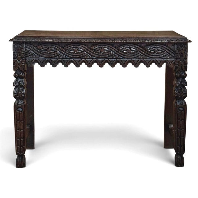 An 18th century English console table hand carved from solid oak, with a rich, time-softened patina and wonderful depth of...