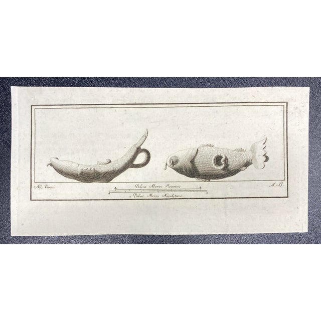 1762 copper plate engraving of two Roman oil lamps.