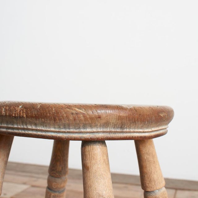 Vintage Rustic Wooden Stool A fabulous antique pine stool featuring beautifully turned legs and a classic cross-stretcher...
