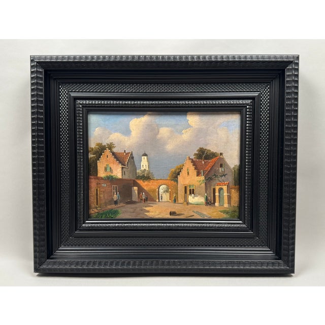 Oil on canvas depicting a Flemish or Dutch village square, painted in the mid-19th century and inspired by the Flemish...