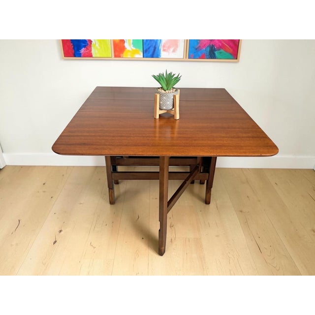 Introducing our stunning vintage Mid Century teak G Plan Style Gate Leg / Drop Leaf Dining Table! This beautiful piece...