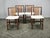 Exceptional set of four Danish dining chairs crafted from solid teak during the 1960s. Featuring elegant Scandinavian...