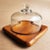 Offered is a charming small square teak cheese/charcuterie board with a glass cloche made by Goodwood in the 1970s....