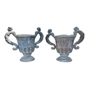 A Pair of Neoclassical Lead Urns Planters