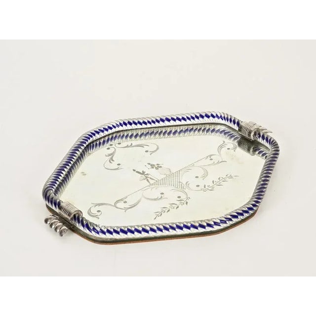 Marvelous hexagonal Art Deco mirror tray in blown Murano glass, engraved mirror and silver. This incredibly charming and...