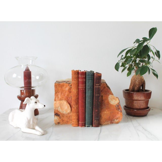 Pair of vintage onyx natural stone bookends. No makers mark. Some age wear. Pictured.