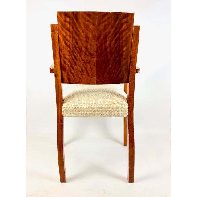 The armchair appears to have undergone restoration some 20 to 30 years ago. The solid walnut wood features a thick French...