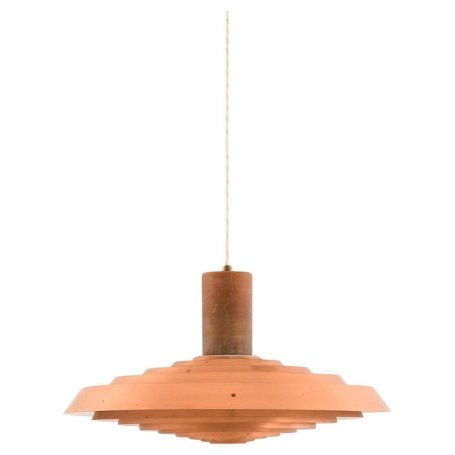 The langelinie ceiling lamp, designed by poul henningsen and produced by louis poulsen in denmark during the 1950s, stands...