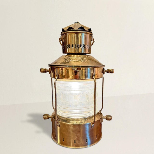 A little bit of harbor romance, captured in brass and glass. This 20th century pendant lantern takes its cues from the...