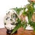 Decorative Egg on a wooden support. with African style Safari decoration. Made of porcelain. Signed on the bottom.