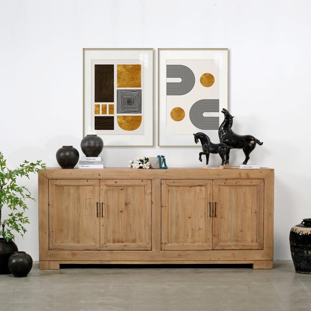 Handcrafted from unsealed solid wood, this grand four-door tall sideboard brings warm architectural presence and...