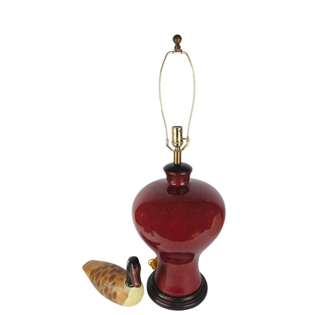 A monumental table lamp by Frederick Cooper Studios of Chicago, its ceramic body finished in a deep sang de boeuf glaze...
