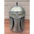 A vintage pewter ice bucket formed as a medieval knight’s helmet, detailed with riveted construction, a pierced visor, and...