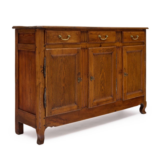 Three door buffet from early 19th century, France. This piece is made of solid wood construction, primarily cherry wood...