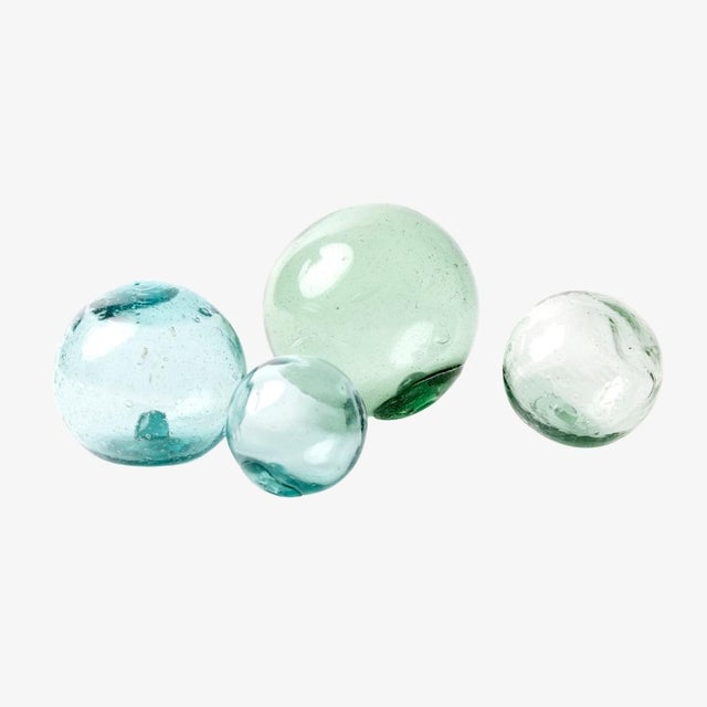 - One of our favorite objects, these antique, Japanese glass floats were originally attached to fishing nets as a means of...