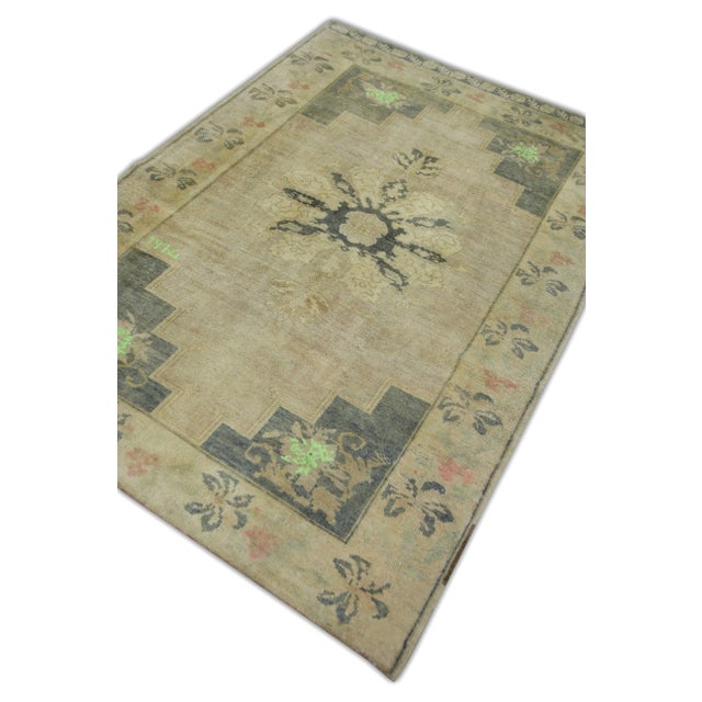 Introducing a one-of-a-kind vintage Turkish hand-knotted wool rug, carefully crafted by skilled artisans using traditional...