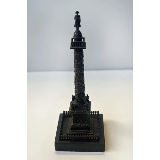 Traditional bronze sculpture of the Vendôme Column with Napoleon standing gracefully on top. These statues are...