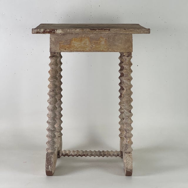 What an attention grabbing antique table. The shape, patina, painters top, spiral legs, yoke base, and distressed state...