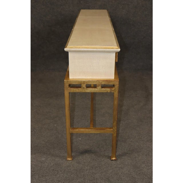 Hollywood Regency Style Crackle-Painted and Gilt Iron Console Table – Timeless Glamour and Modern Elegance This striking...