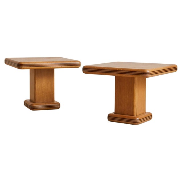 Sold and priced individually. Sourced in the south of France and crafted in the 1960s, this square side table is rendered...