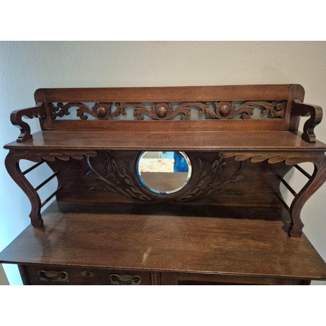 This antique piece is a classic American Victorian "side-by-side" secretary desk and bookcase, typically dating from the...