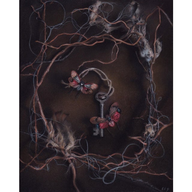 Entanglements features a delicate arrangement of intertwined fibers surrounding a vintage key and two vibrant butterflies....