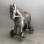 A finely detailed silver-tone metal horse on wheels to enliven any decor. Doesn’t even need hay or a stable! Excellent...